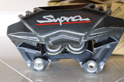 Toyota Supra MK4 new parts-front brake calipers pair close up angle